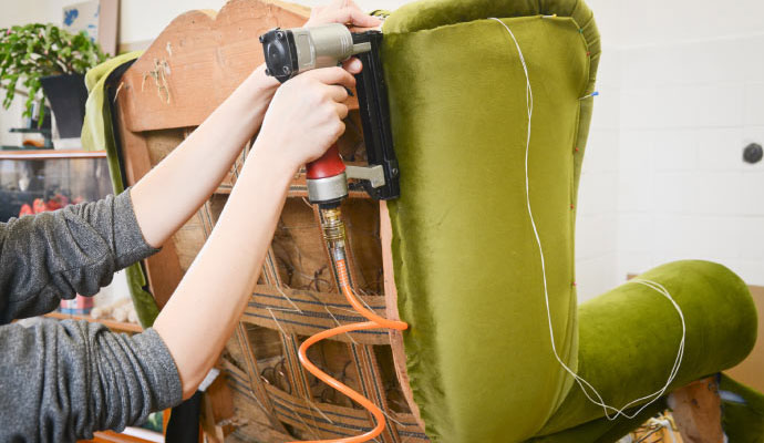 professional worker restoring upholstery