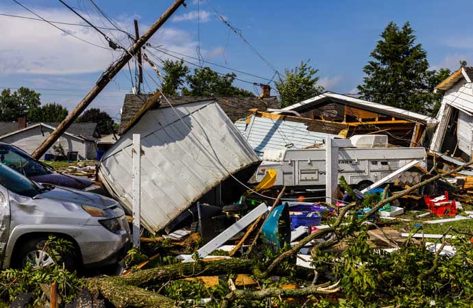 Storm damage with collapsed structures, debris