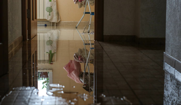 hallway with a significant amount of water on the floor