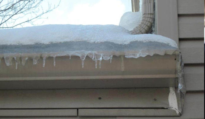 roof covered with snow and ice