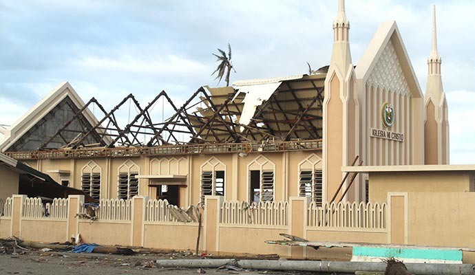 damaged building with a collapsed roof