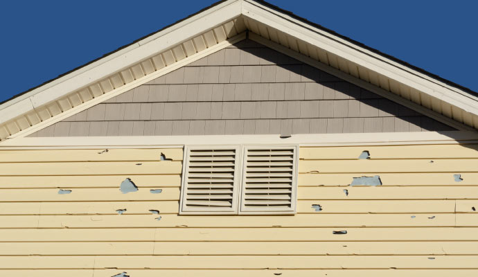 House siding damaged by hail storm