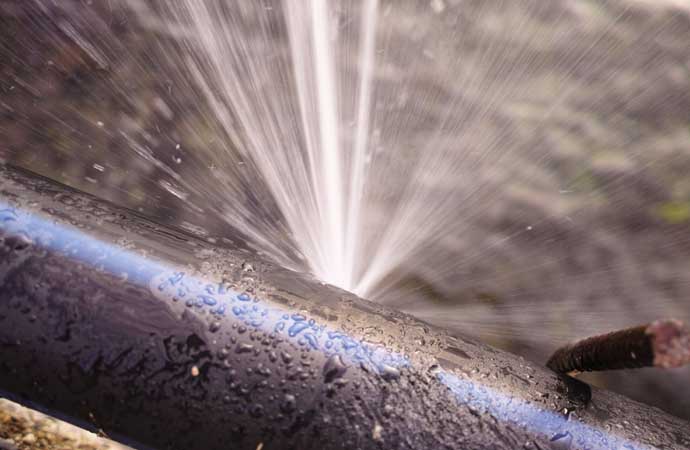 Close-up view of a burst pipe