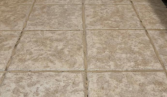 tiled floor showing damaged tiles