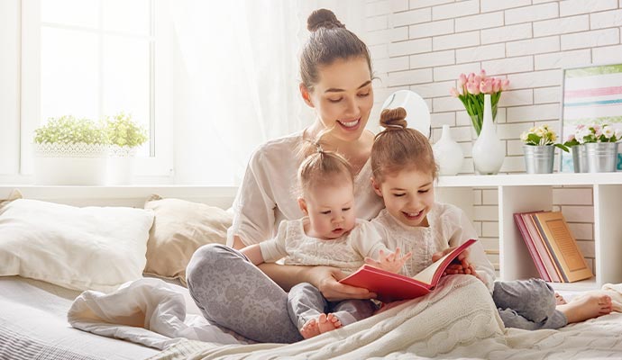 A woman and children relaxing